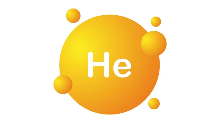 Símbolo del helio (He) dentro de una esfera amarilla con esferas más pequeñas alrededor, sobre fondo blanco. 